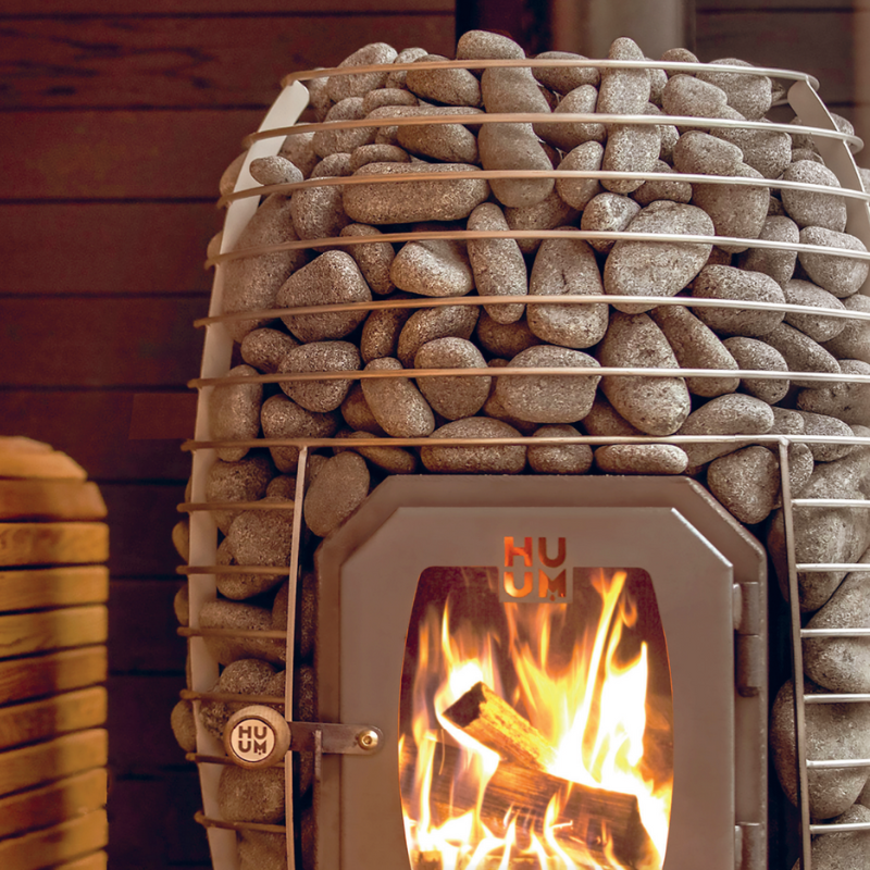 Fasssauna mit Holzofen oder Elektroofen? Die ehrliche Entscheidungshilfe